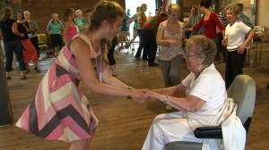 Young Girl Dancing with Older/Elderly Woman in Wheelchair