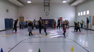 Students using Hoola Hoops in Gym