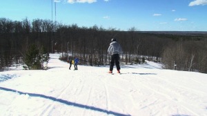 Downhill Skiing from Top of Hill