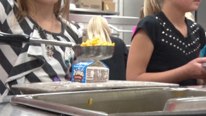 School Lunch Being Served to Students in Line