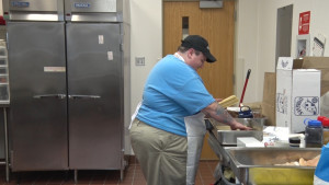 Cook Preparing Food in Commercial Kitchen