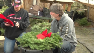 People Prepairing Christmas Wreaths
