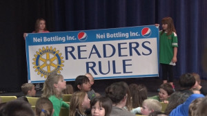 Kids Holding Readers Rule Banner