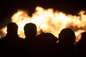 Silhouets of People Watching a Fire