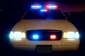 Police Car with Lights on At Night