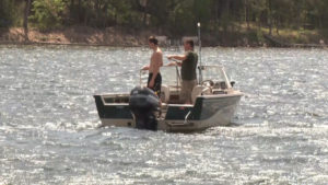 Two People Fishing from Boat