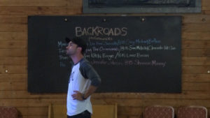 Backroads Man In Front of Chalkboard