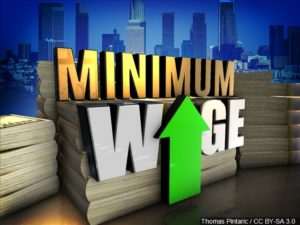 Minimum Wage on Stacks of Cash