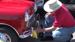 Man Cleaning Antique Car
