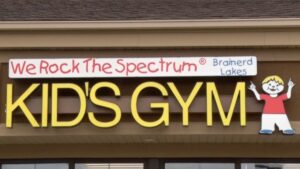 We Rock the Spectrum Kid's Gym Brainerd Lakes Sign 16x9